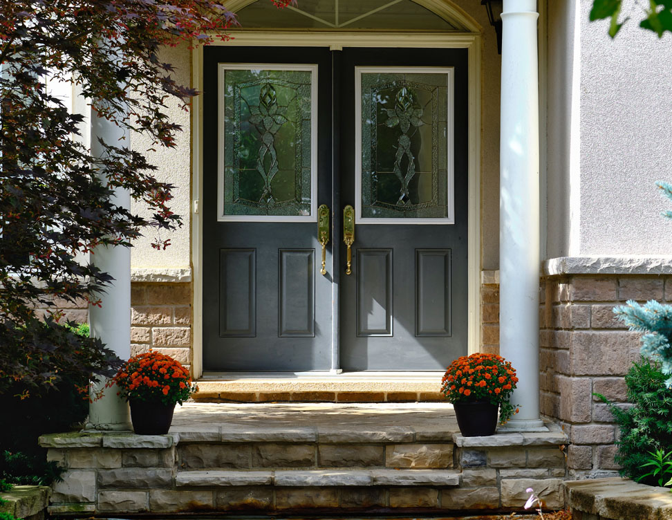 Photo of well-installed double entry doors on a fine home
