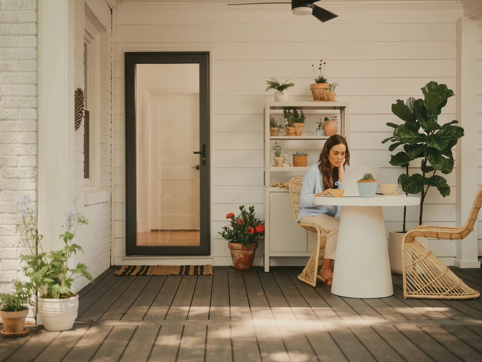Woman relaxing beside her newly installed storm and entry doors